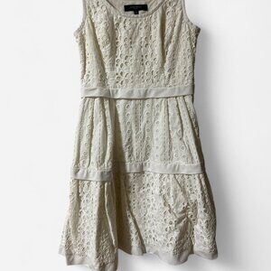 Cream eyelet dress with a touch of whimsy